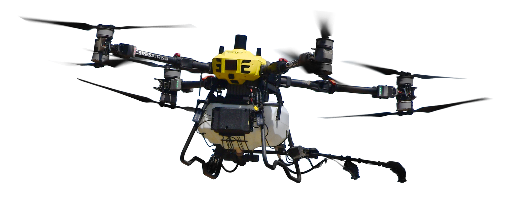 Ceres Air spray drone over a field at sunset